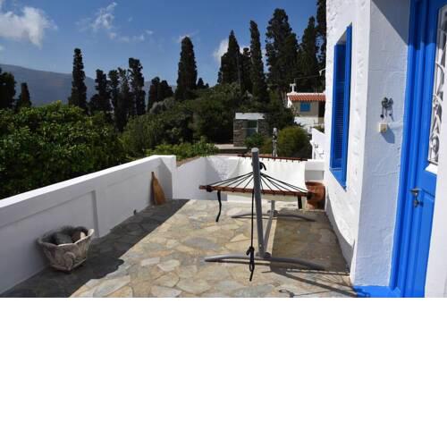 Traditional cycladic house with view in Andros